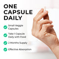 Vitamin_D3_K2 Hand holding a capsule with product information text on a white background